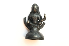 A Chamba seated brahmanical deity holding a pot in his raised left hand